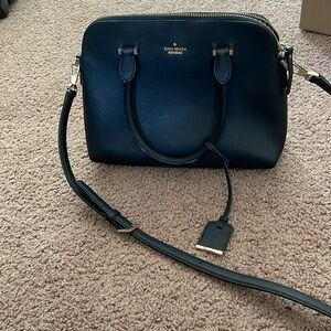 Kate Spade  Bag with handles and side strap.